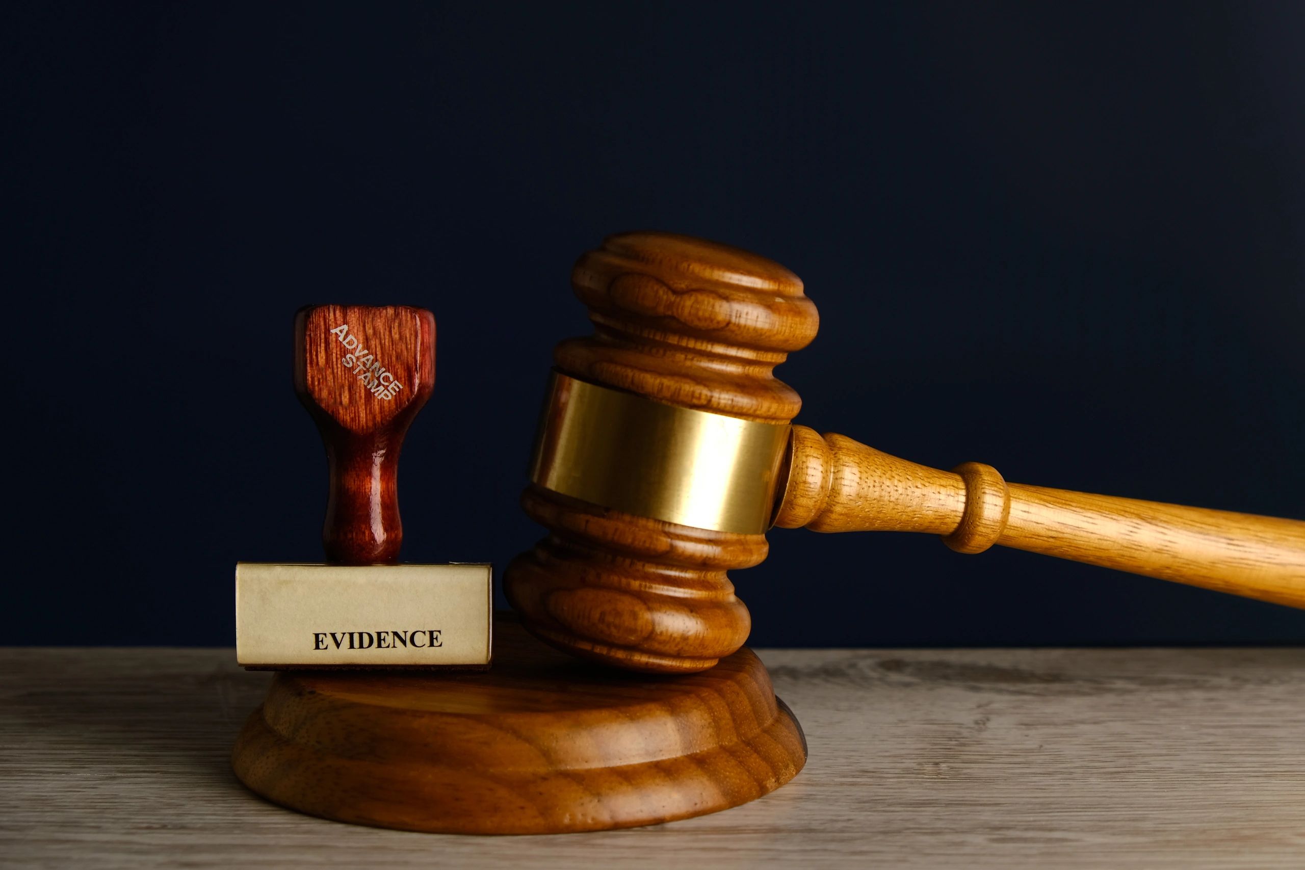 Close-up of a stamp and gavel representing official documentation